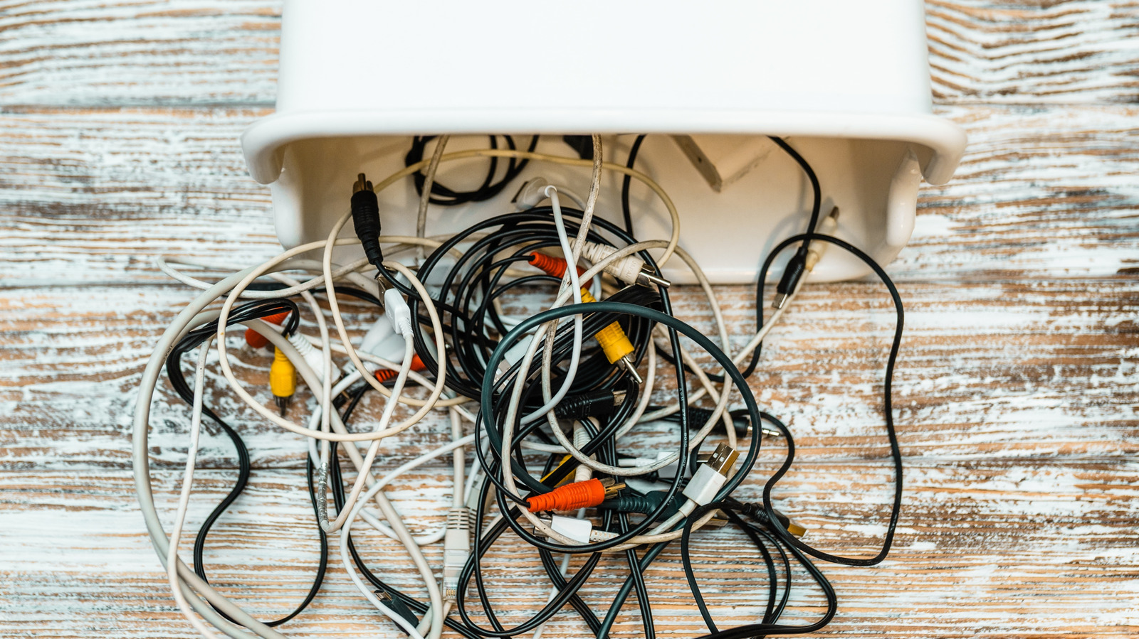 keep-cords-organized-and-clutter-free-by-using-an-old-shoe-box