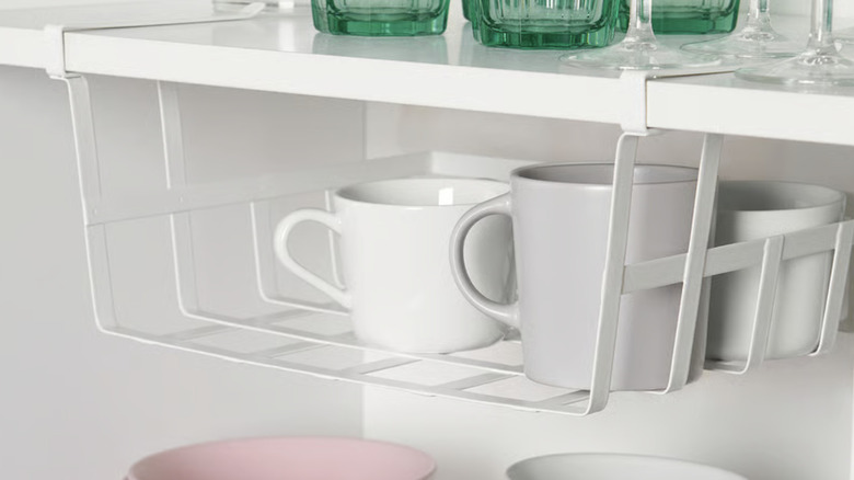 IKEA clip-on basket holding coffee mugs