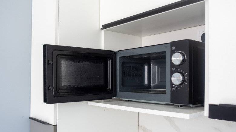 Empty microwave with door open