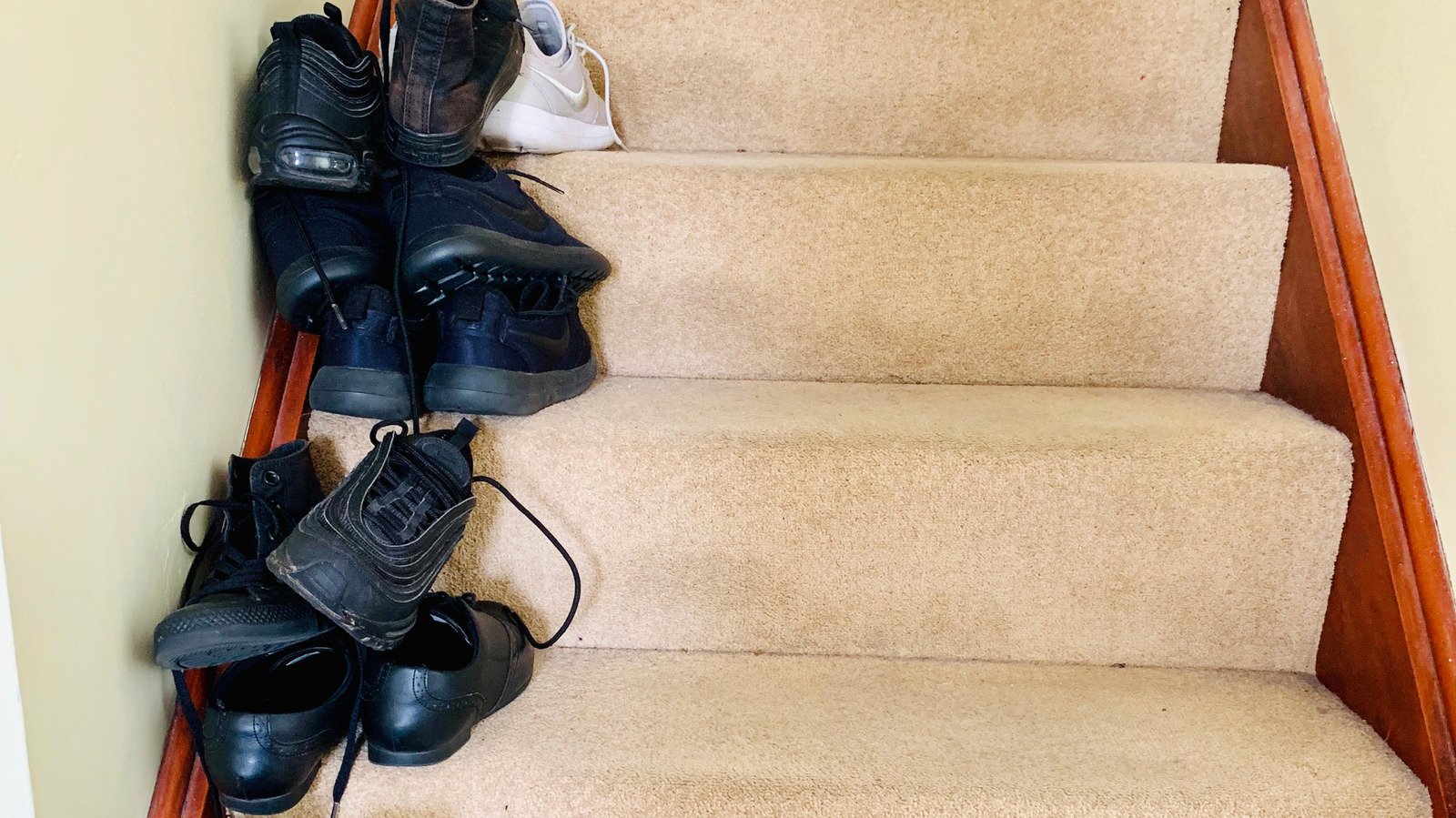 stairs-in-your-entryway-causing-clutter?-this-diy-shoe-storage-rack-is-the-solution