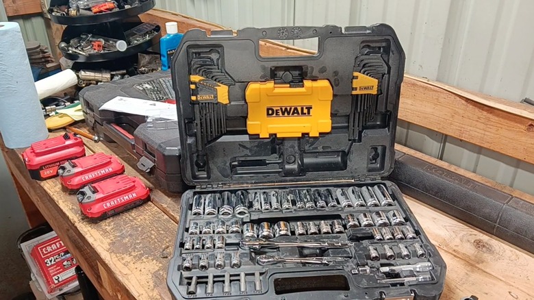 Open DeWalt Mechanics Tools Kit and Socket Set in cases on workshop table