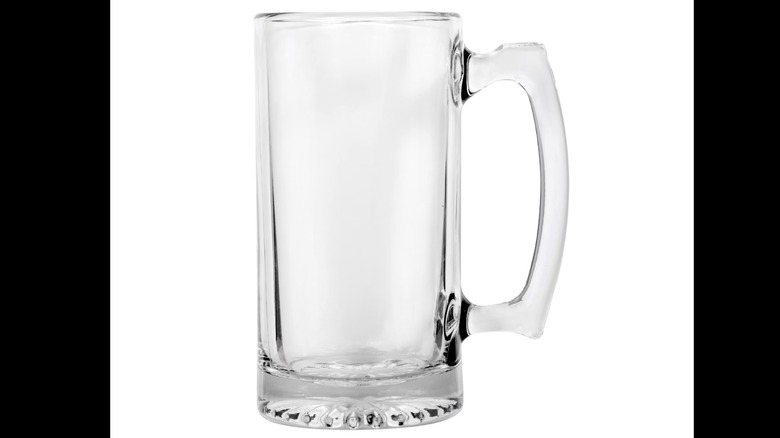 A clear glass beer mug from Dollar Tree displayed against a white background.