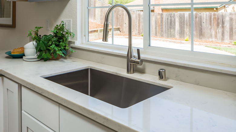 stainless steel undermount sink in granite countertop
