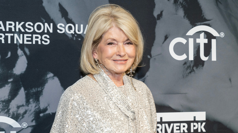 Martha Stewart smiling in a sequined beige sweater.