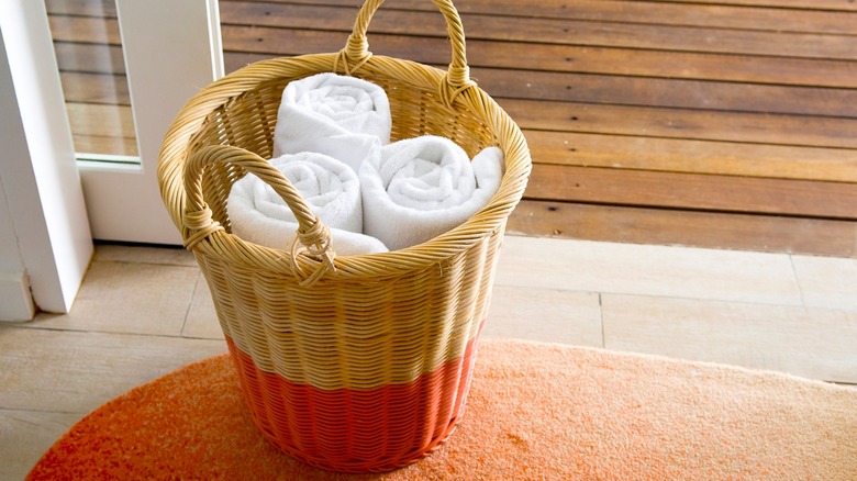 Rolled towels in basket