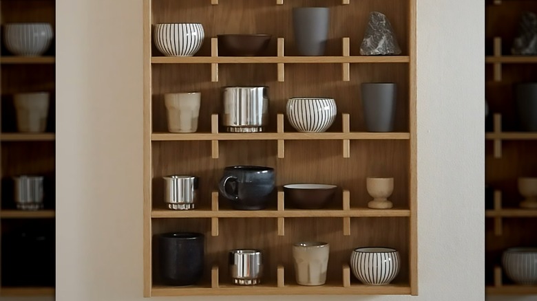 Close up of wooden open cabinet with decor