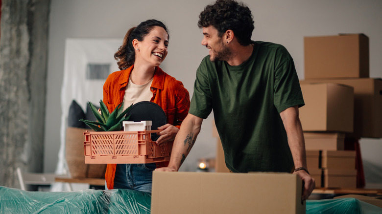 young people moving into a house