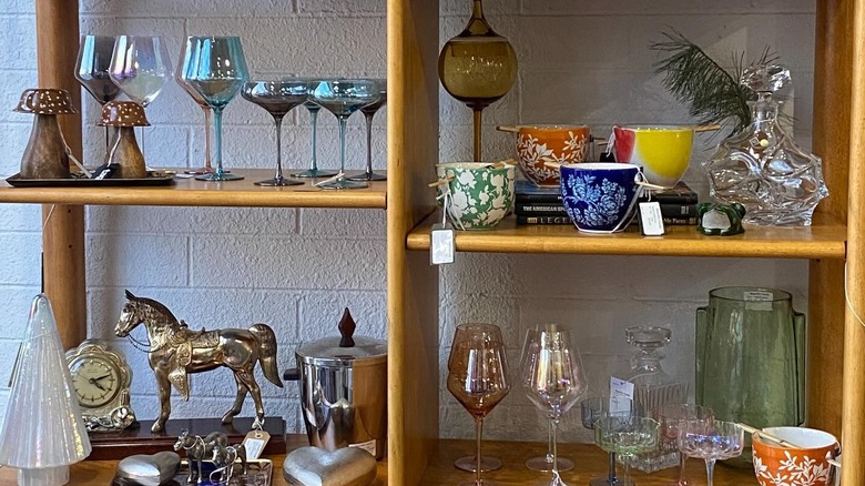Colorful glasses and unique decor in open shelves