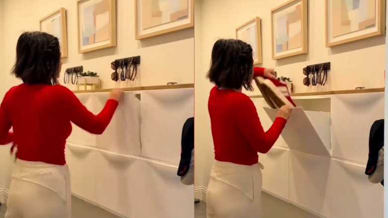 A woman putting shoes into an IKEA TRONES drop zone