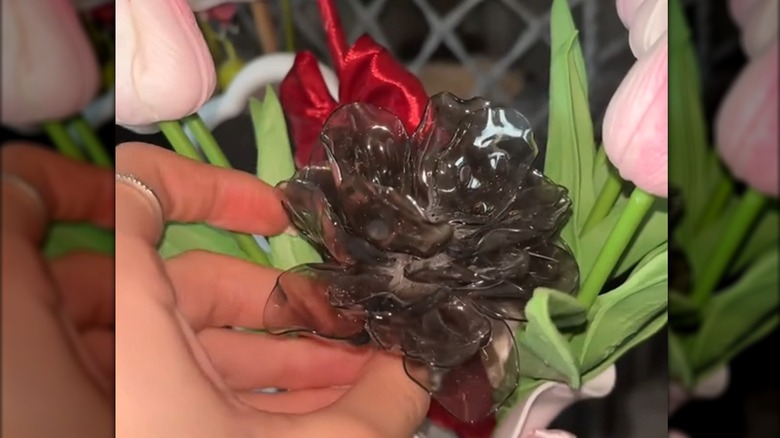 Plastic spoon rose in a vase of flowers
