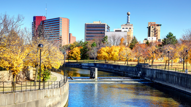 autumn setting of Flint River with the city in the background