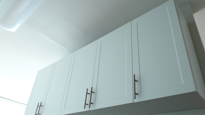 A run of white upper cabinets
