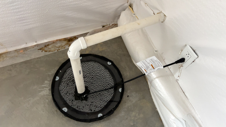 Overhead view of sump pump in basement