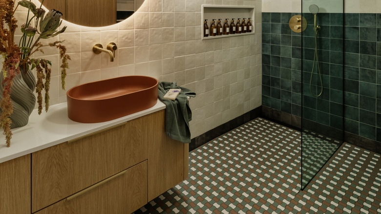 A modern bathroom with patterned tiles.