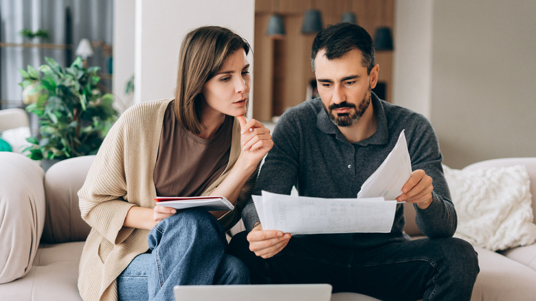 A young couple determining how to save for retirement.