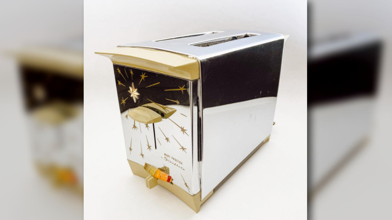 Closeup of a Mary Proctor Starflite toaster with star emblems on a white background