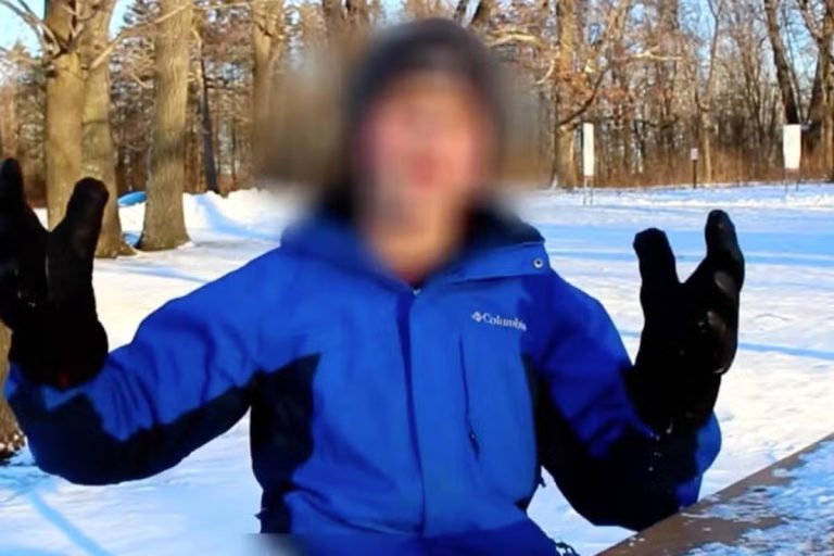 Man hiding his face claims he is from year 6,000 and shows blurry future city photo