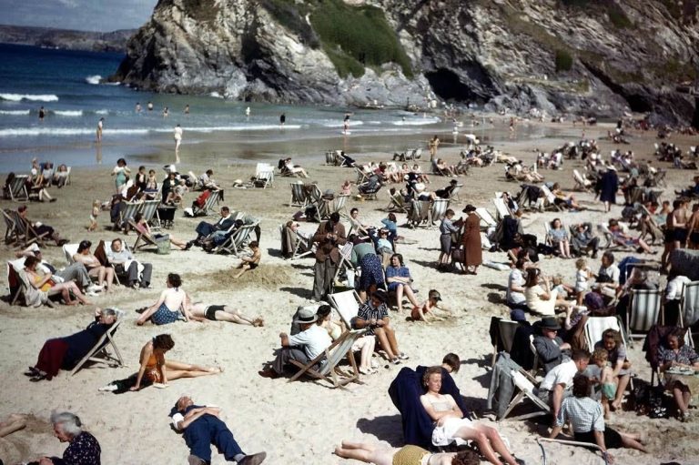 Sleuths claim man seemingly checking phone in 1943 Cornwall beach photo is a time traveler
